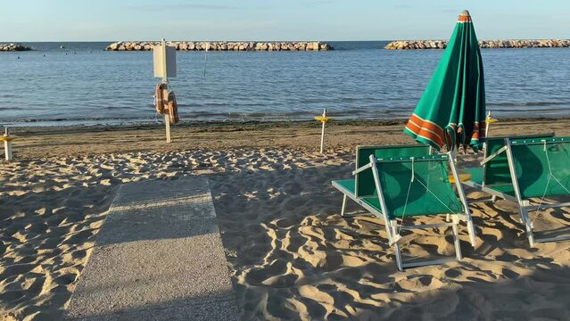 Gabicce, Pesaro Urbino, Italy . Sand and umbrellas at the beach of Gabicce Mare. Concept for summer, beach, Italy, nature, fun, holydays, relax