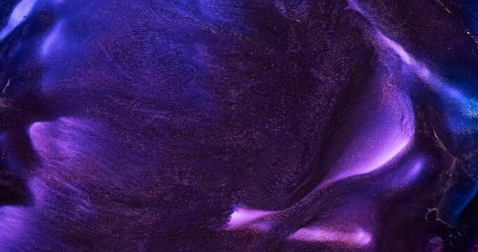 Dark purple paint splash abstract background. Dark violet blue wave flow 4k video. Black lilac art ink. Shiny purple liquid. Acrylic texture in motion. Glitter fluid pattern. Sparkling moving backdrop