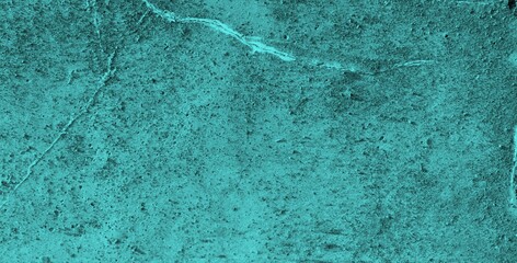 A textured background featuring a deep teal color with a distressed, grunge appearance. The surface shows variations in tone and subtle patterns, creating an abstract and moody aesthetic.