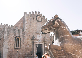 Close up of a horse fountain in front of  the duomo di Taormina