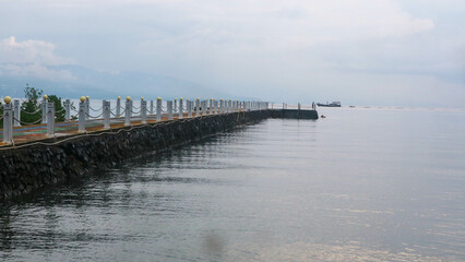 Fototapeta na wymiar an amazing pier on manado beach