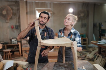 Contemporary Carpenter Working, Portrait of modern carpenter making wood furniture while working in joinery lit by sunlight with factory background on small business concept, copy space