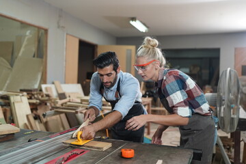 Contemporary Carpenter Working, Portrait of modern carpenter making wood furniture while working in joinery lit by sunlight with factory background on small business concept, copy space