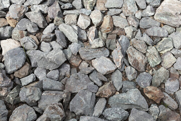 Gray gravel covering the ground at road construction site