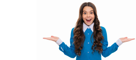 presenting product on copy space. amazed kid with curly hair. beauty and fashion. Child face,...