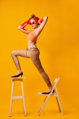 Weird people concept. Creative portrait of young girl in avant-garde style image isolated over...