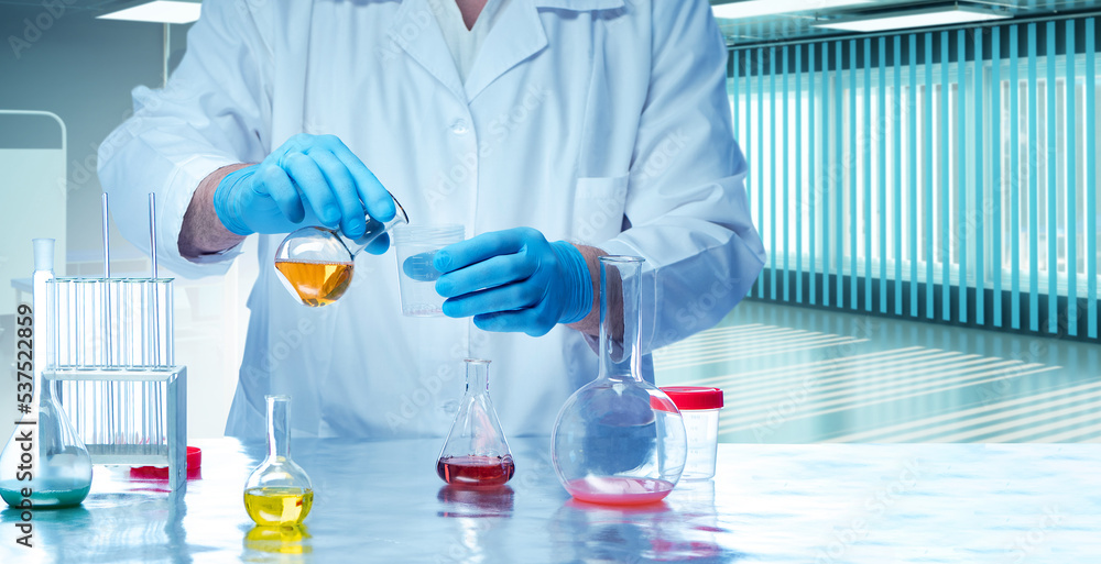 Poster laboratory technician. scientists hands with test tubes. flasks with multi-colored liquid on laborat