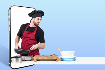 Recipe book app. Man is cook. Phone on blue. Concept recipe book for smartphone. Guy cook with frying pan. Electronic recipe book. Man chef and kitchen utensils. Chief in black uniform and hat.