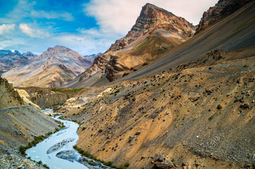 The scenic landscape of Spiti river valley with gully eroded and pinnacle weathered geological...