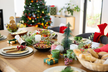 Close up of table with dinner and decorations at christmas
