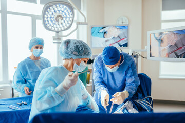 Surgeons team during preparation for surgery before performing operation in hospital operating...