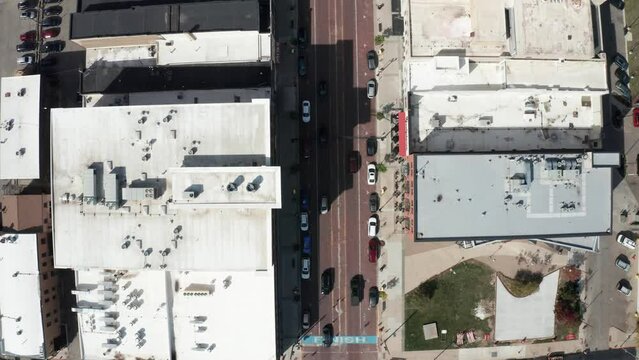 Downtown Flint, Michigan overhead drone shot following car.