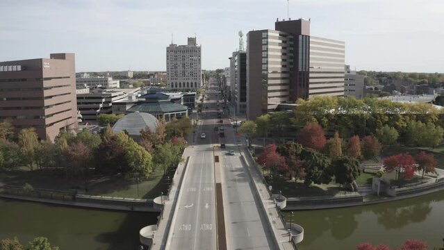 Flint, Michigan skyline with bridge and cars moving with drone video stable.