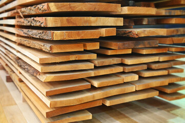 Raw stacked woodden planks isolated selective focus blur effect