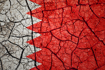 Dry soil pattern on the flag of Bahrain. Country with drought concept. Water problem. Dry cracked earth country.