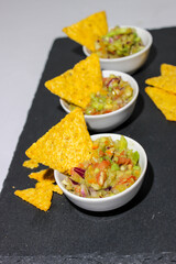 Mexican guacamole sauce with nachos chips