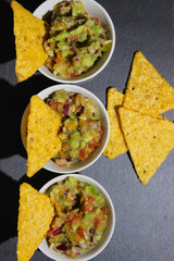 Mexican guacamole sauce with nachos chips