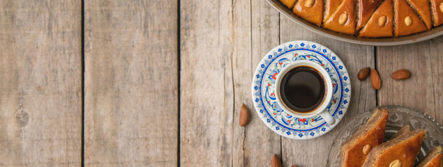 A cup of Turkish coffee and baklava. Selective focus.