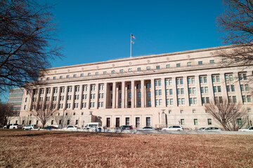The Stewart Lee Udall Department of the Interior Building in Washington, D.C. on a sunny winter day. Low angle wide shot, cloudless sky, no people.