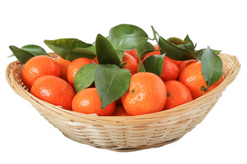 Tangerines  with leaves in a straw basket