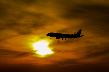 silhouette airplane in the sunset