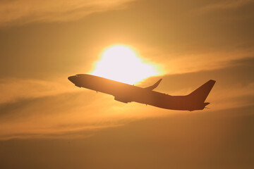 silhouette airplane in the sunset