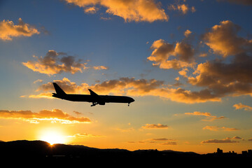 silhouette airplane in the sunset