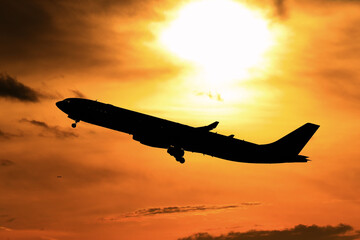 silhouette airplane in the sunset