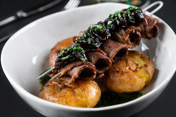 fried beef meat and potatoes