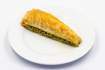 Pistachio baklava or carrot slice baklava isolated on white background. Traditional Turkish cuisine...