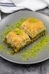 Pistachio baklava on dark background. Traditional Turkish cuisine delicacies. close up