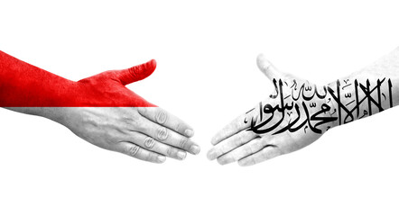 Handshake between Afghanistan and Indonesia flags painted on hands, isolated transparent image.