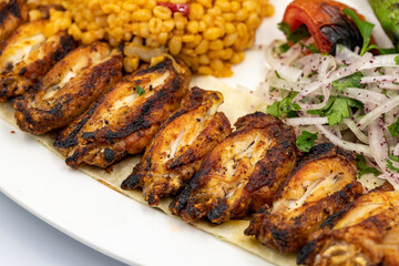 Grilled chicken wings skewers isolated on white background. Turkish foods. close up
