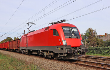 Fototapeta na wymiar Red engine on the railway track