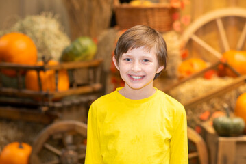 happy boy  at the farm. joyful child celebrates thanksgiving day