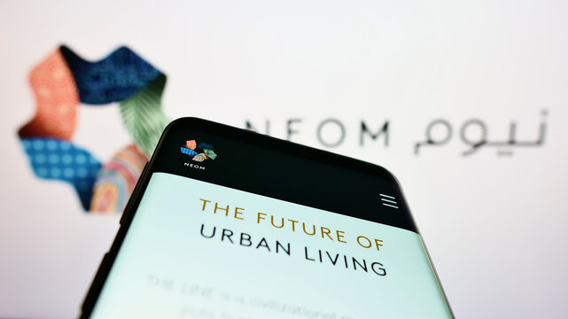 Stuttgart, Germany - 10-01-2022: Mobile phone with website of Saudi Arabian property developer NEOM Company on screen in front of logo. Focus on top-left of phone display.