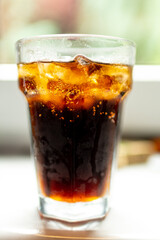 glass of cola with ice