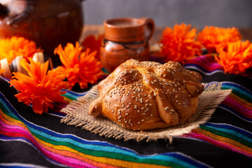 Pan de Muerto. Typical Mexican sweet bread with sesame seeds, that is consumed in the season of the day of the dead. It is a main element in the altars and offerings in the festivity