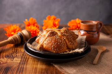 Pan de Muerto. Typical Mexican sweet bread with sesame seeds, that is consumed in the season of the...