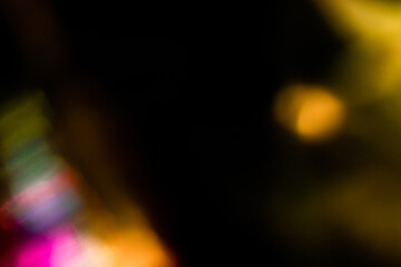Blur colorful rainbow crystal light leaks on black background. Defocused abstract multicolored retro film lens flare bokeh analog photo overlay or screen filter effect. Glow Vintage prism colors