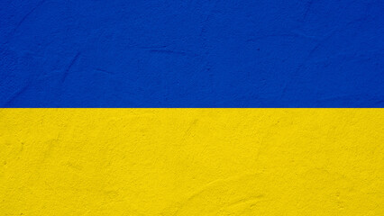 Ukrainian flag background banner panorama - Old rustic damaged concrete stone wall texture background, painted in the colors of the flag of Ukraine....
