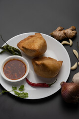 Veg Samosa - is a crispy and spicy Indian triangle shape snack which has crisp outer layer of maida filling of mashed potato, peas and spices