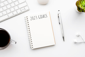 Notebook with 2023 goals text on it to apply new year resolutions and plan.