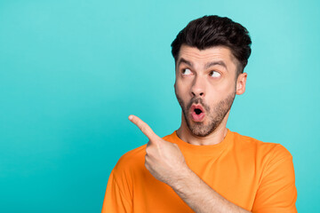 Closeup photo of young attractive funny pretty student bearded man finger pointing empty space...