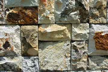 Artificial stone cladding. Designed to resemble real stone. Arranged vertically and attached to the wall with a special adhesive. Used as decoration on the walls of buildings.