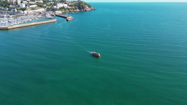 Passenger ferry leaves Torquay harbour on the Devon coast