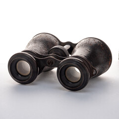 Antique binoculars on a white background