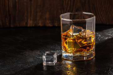 Whiskey with Ice on a Wooden Table