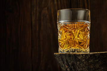 Whiskey with Ice on a Wooden Table