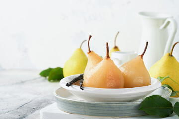 Pears. Poached pears in syrup. Traditional dessert sliced server in a white plate with leaves and at home on a light background. Delicious dessert for holiday. - obrazy, fototapety, plakaty